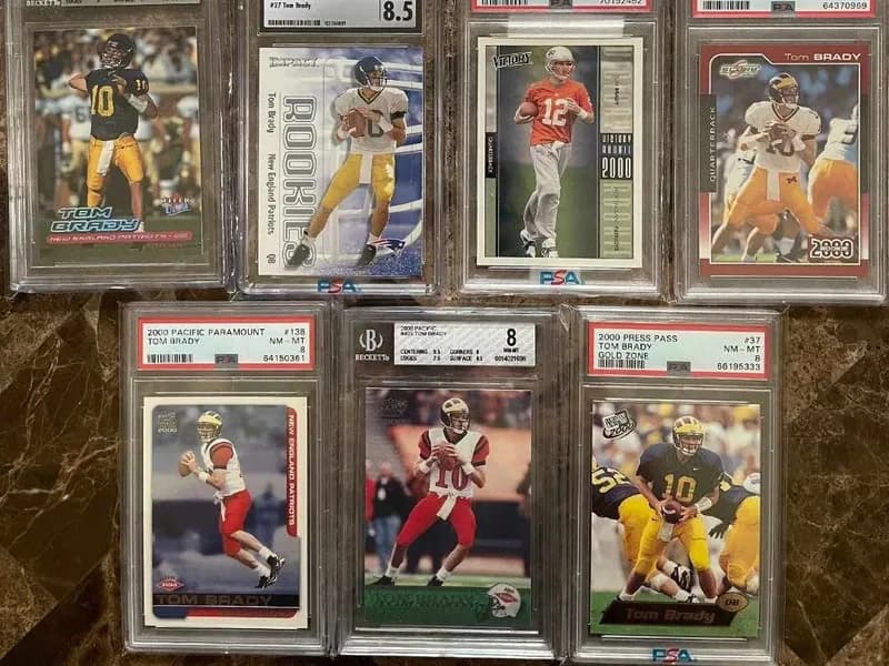 A grid of PSA- and Beckett-graded Tom Brady 2000 rookie cards from Fleer, Pacific, Victory, Score, Press Pass and more