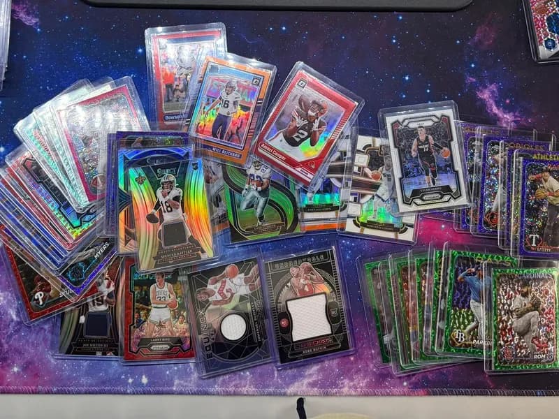 Modern football, basketball, and baseball cards personally handled by iBuy.cards, including relics, parallels, and rookies