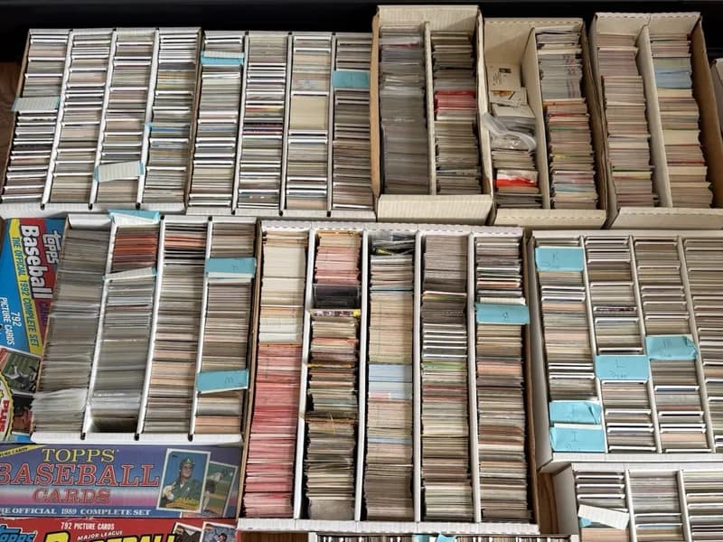 Labeled sports card set boxes and organized rows from a complete collection