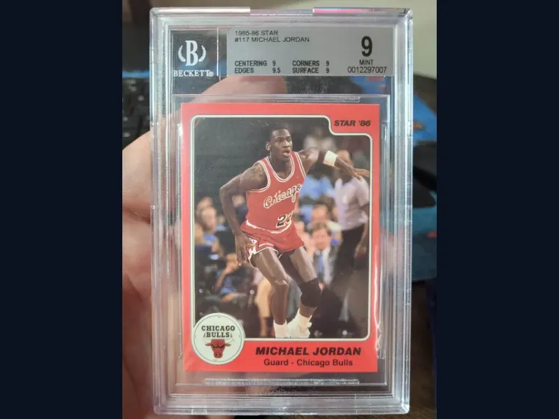 A 1986 Michael Jordan basketball card graded Beckett 9 (Mint) in its slab