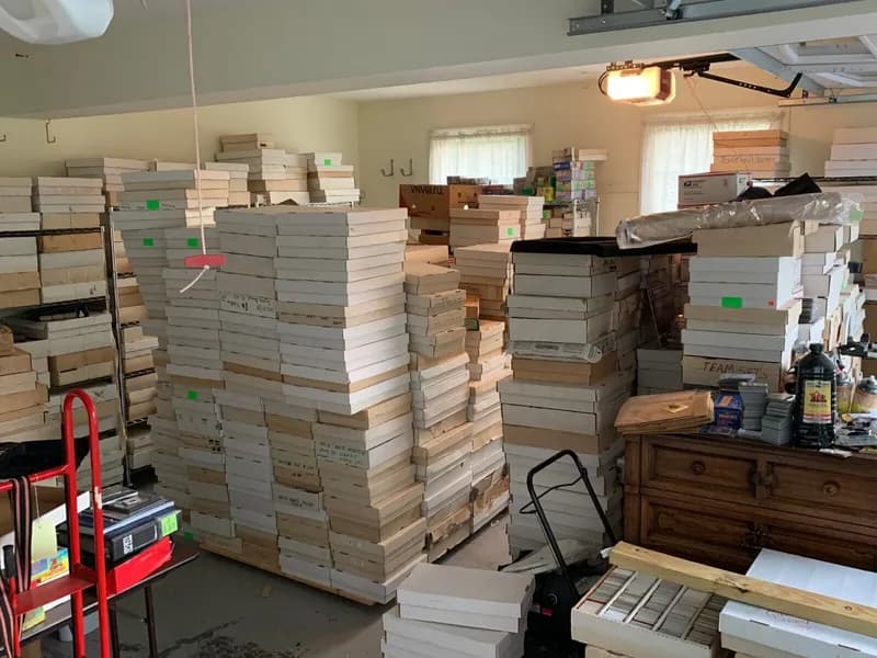 A room stacked with boxes of a purchased sports card collection