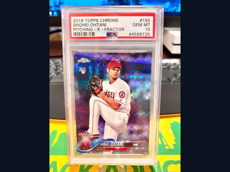 A 2018 Topps Chrome Shohei Ohtani pitching X-Fractor rookie graded PSA 10 that iBuy.cards personally handled