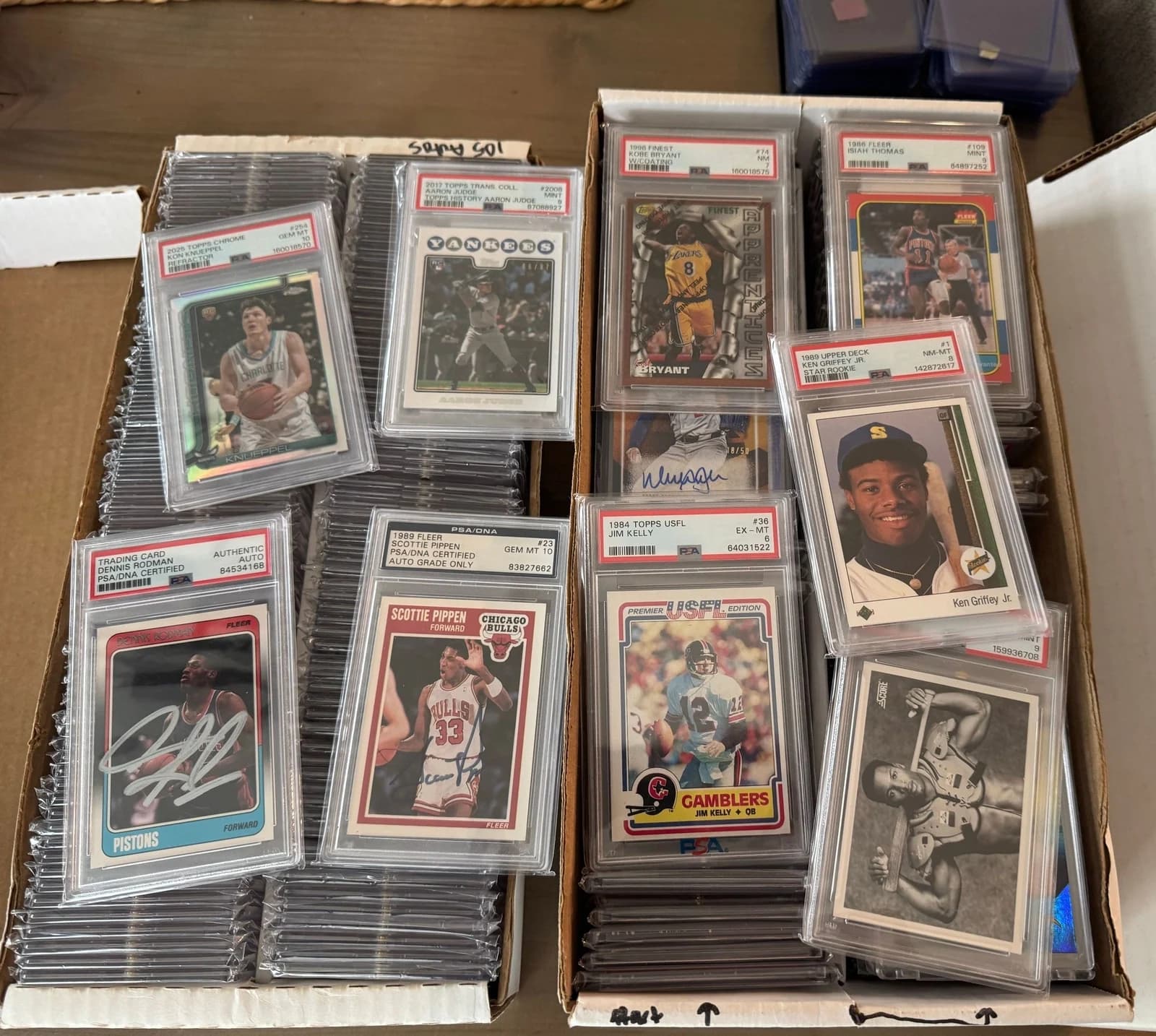 A purchased collection of graded baseball, basketball and football cards with authenticated autographs